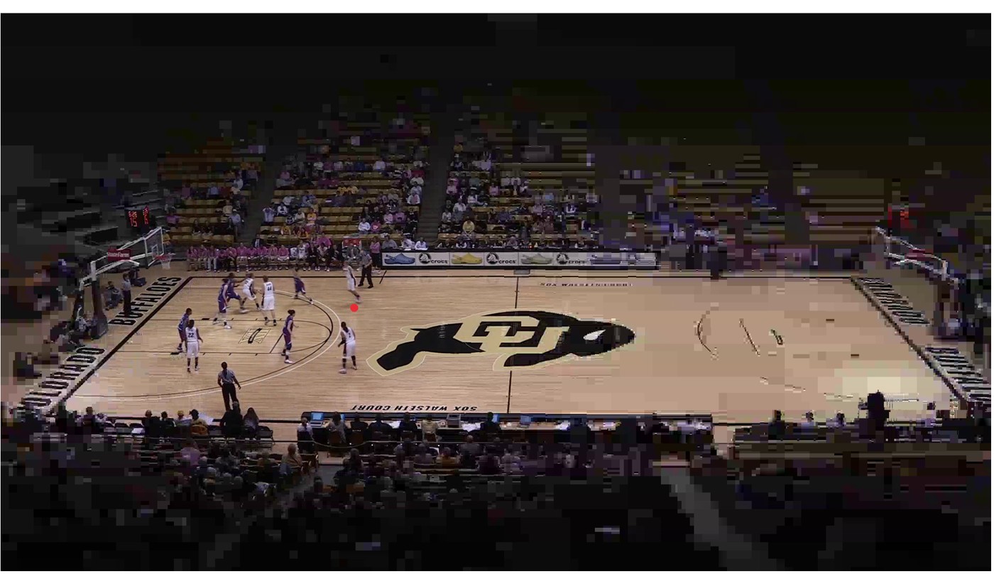 A basketball frame with sharp detail around the players on the left side of the court and visible blocking artefacts in the stands and foreground